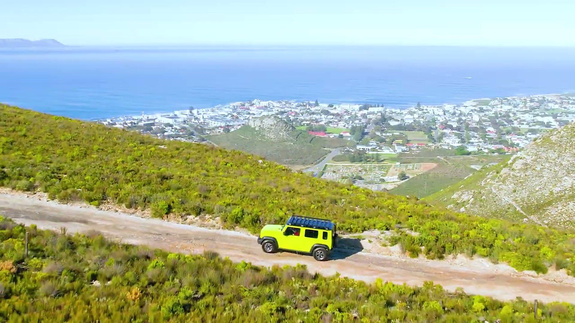 Location vehicle on a coastal road during a video production shoot
